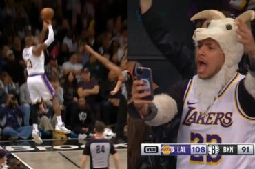 LeBron James hits insane 3 falling out of bounds and has Nets fans cheering 😱