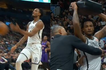 Nic Claxton tries to throw cushion after being ejected for throwing ball into crowd