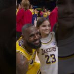 LeBron with a young fan after the game!