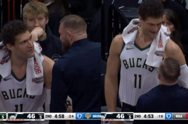 Conor McGregor sizing up Brook Lopez on the Bucks bench 😂