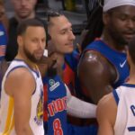 Steph Curry gets into it with Isaiah Stewart on Pistons bench and Stewart shoves Curry
