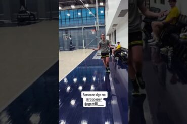 Caitlin Clark throwing football around at Indiana Pacers training facility