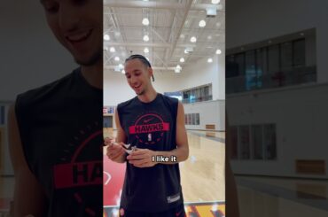 Zacch sees his first-ever bobblehead! #nba #hawks #zaccharierisacher #bobblehead